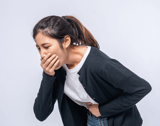 Woman appearing to throw up due to GERD